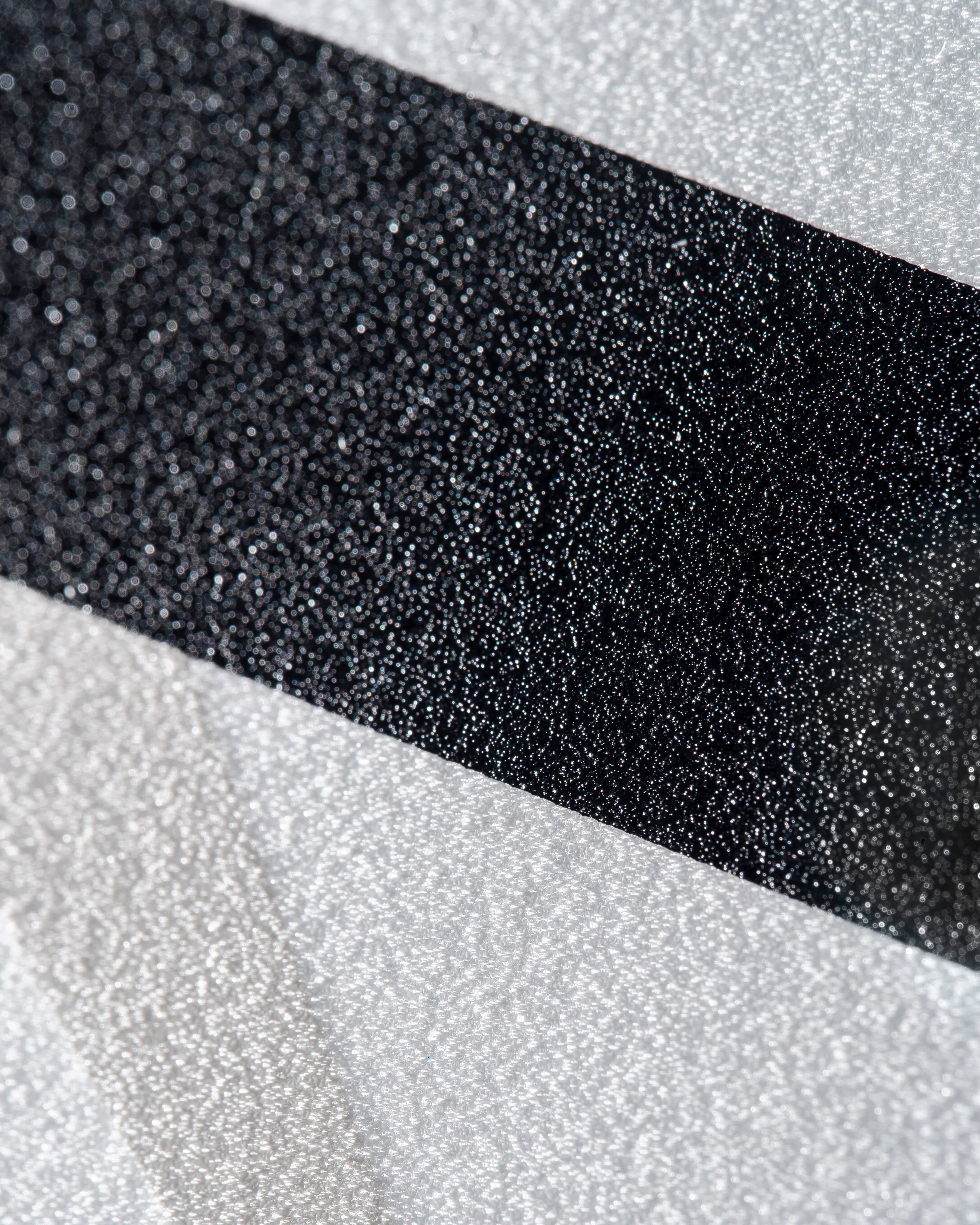 Close-up of ProSpin+ NextGen Texture showing a blend of black and silver surfaces.